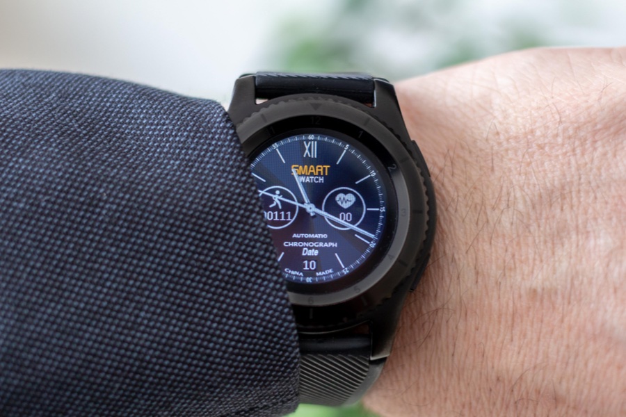 A closeup shot of a smart watch on a persons wrist